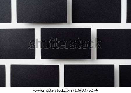 Design concept - top view of black business card isolated on white background for mockup, it's real photo, not 3D render