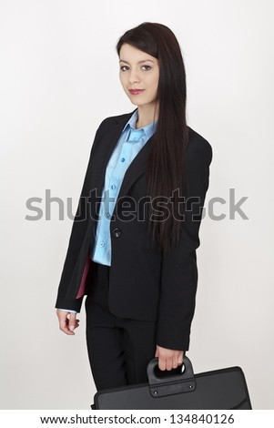 business woman holding a briefcase shot on white background?