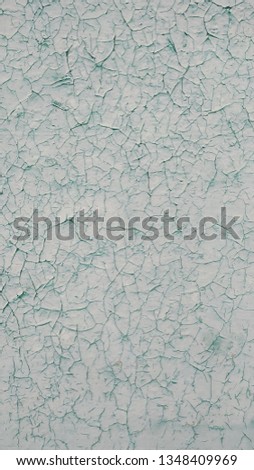 Old light green wooden wall with peeling paint. Background, texture, blank.
