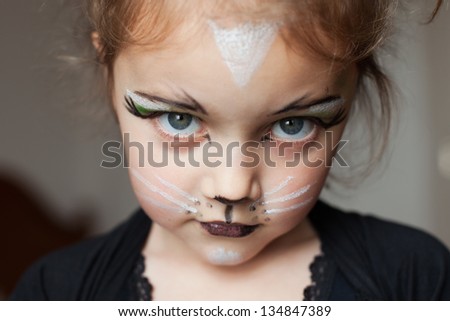little girl with kitty cat make up