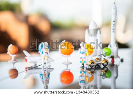 Little boy playing space ship and planet galaxy toy 