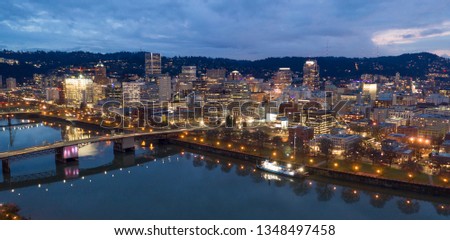 The city skyline glows at dusk in this aerial view of Portland Oregon