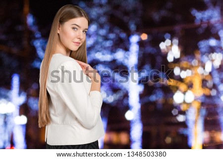 Portrait of confident young woman standing