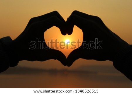 sun set with heart sign of love