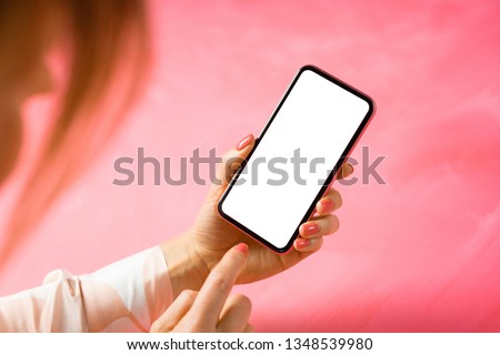 Woman using mobile phone with empty white screen, mockup for your app design.