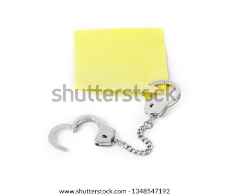Blank paper with handcuffs isolated on white background