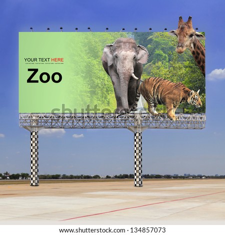 Elephant, tiger and giraffe in the zoo on outdoor billboard
