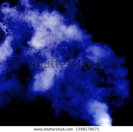 blue smoke blowing on dark background 