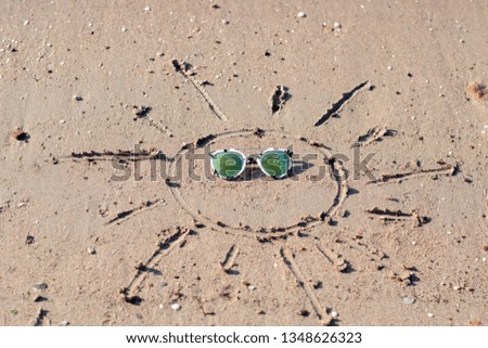 Sun drawing in the sand