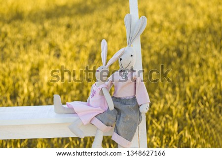 Happy couple handmade linen toys rabbits . Easter and Valentine Day holiday concept. Wedding theme. - Image
