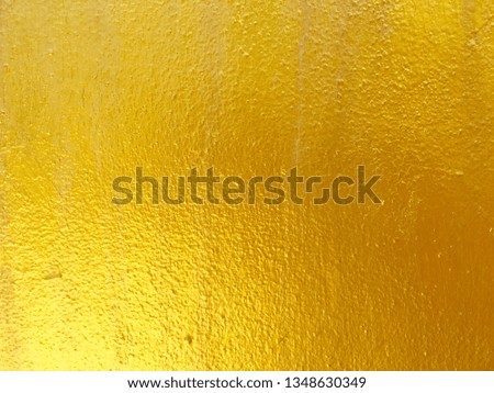 Gold color concrete wall background for texture
