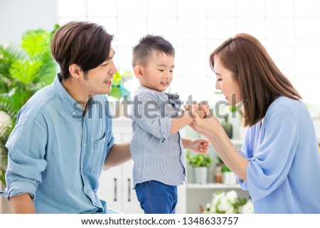 Happiness asian family - Young parent play with child happily at home