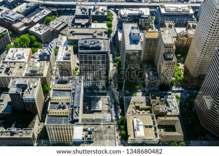 Downtown Seattle skyline, WA, USA. Aerial view of an urban cityscape with skyscrapers, buildings and streets.