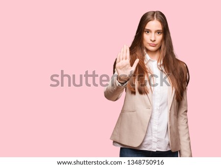 Young caucasian business woman putting hand in front