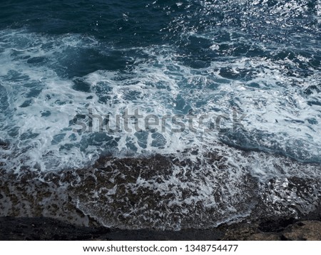 Waves coming to the rocky shore