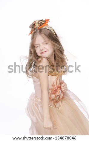 Cute little girl dancing on a white background