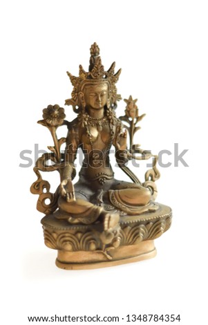 Copper Tara statue on a white background