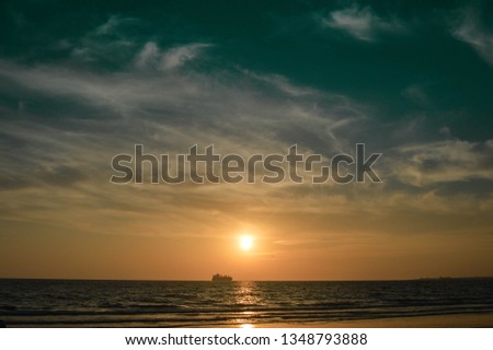 Merchant ship at sunset