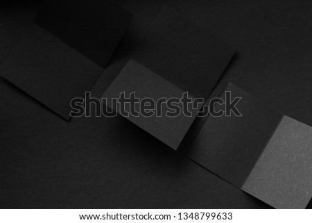 Blank portrait A4. brochure magazine isolated on gray, changeable background / black paper isolated on Black, dark tone