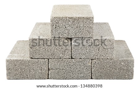 Six gray concrete construction blocks stacked together in the shape of a pyramid. Isolated on white background. Royalty-Free Stock Photo #134880398