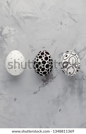 Modern painted marker easter eggs with memphis style print on grey background close-up.Easter ideas.Copy space for text.Minimalism