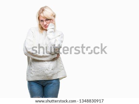 Young beautiful blonde woman wearing winter sweater and glasses over isolated background thinking looking tired and bored with depression problems with crossed arms.