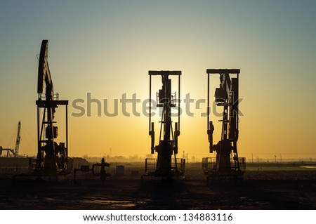  Work of oil pump jack on a oil field. Oil and gas industry.