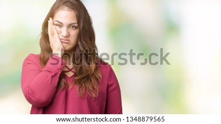 Beautiful plus size young woman over isolated background thinking looking tired and bored with depression problems with crossed arms.