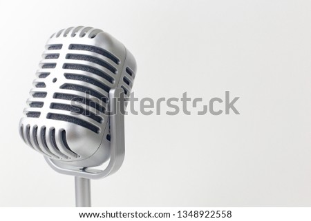vintage microphone close up image on white background.
