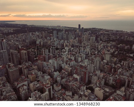 Aerial photography with drone at dusk of the city of Buenos Aires and its buildings in orange tones. Buenos Aires, Argentina.