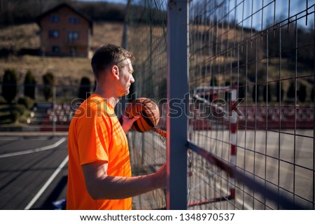 Basketball player at street court