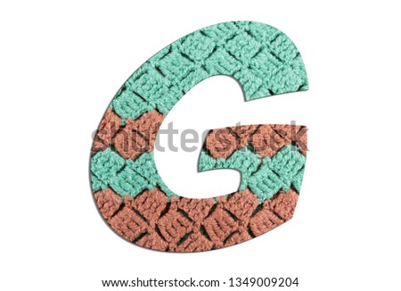 Letter G alphabet with hand knitted texture on white background