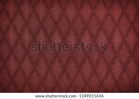 Texture of red fabric with diamond or rombic pattern
