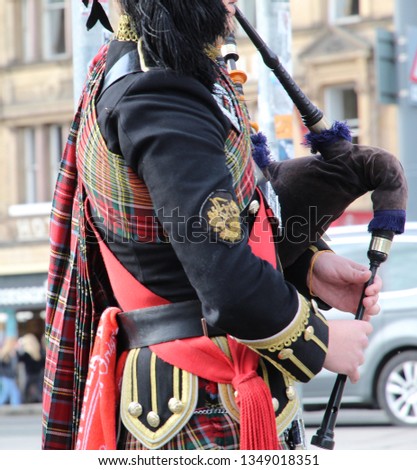 Bagpiper in Highland Dress Playing in Edinburgh