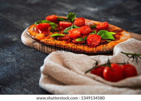 Sausage Pizza with Ham and tomatoes