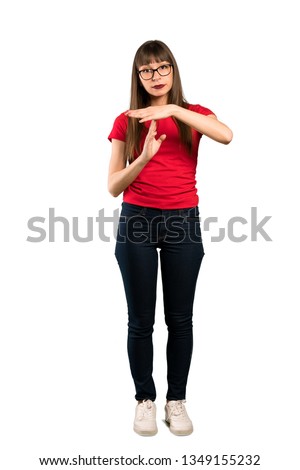 Full-length shot of Woman with glasses making time out gesture