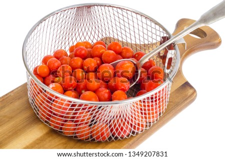 Tomatoes, frozen in refrigerator isolated on white. Studio Photo