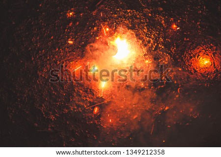 Luminous firecrackers spinning sparks of fire.