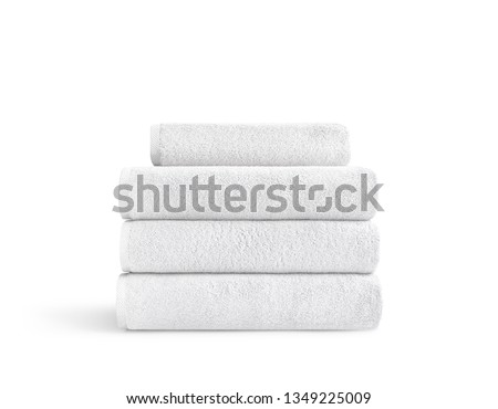 White terry towels in stack against white backdrop, folded soft bath towels, stack of white cotton towels on a white background   Royalty-Free Stock Photo #1349225009