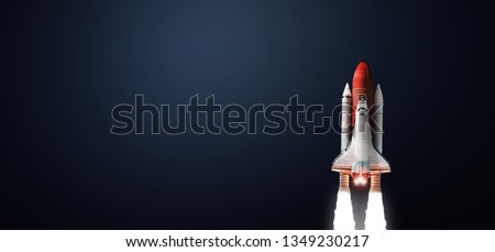 Space shuttle on dark isolated background. Wallpaper with the rocket. Elements of this image furnished by NASA Royalty-Free Stock Photo #1349230217