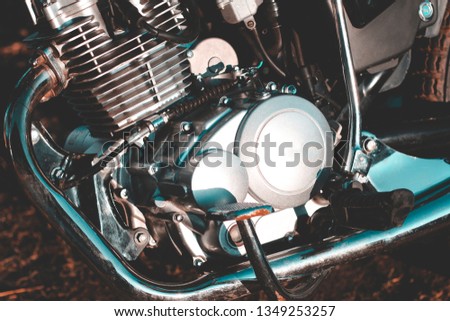 motorcycle. the main part of the engine. there is dirt on it. close-up.