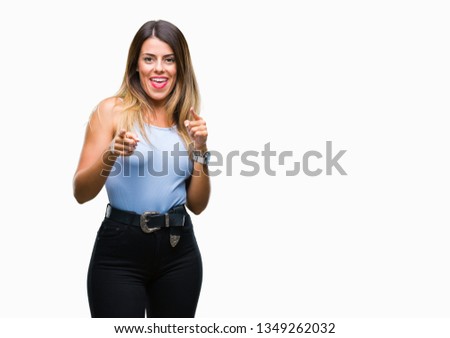 Young beautiful elegant business woman over isolated background pointing fingers to camera with happy and funny face. Good energy and vibes.