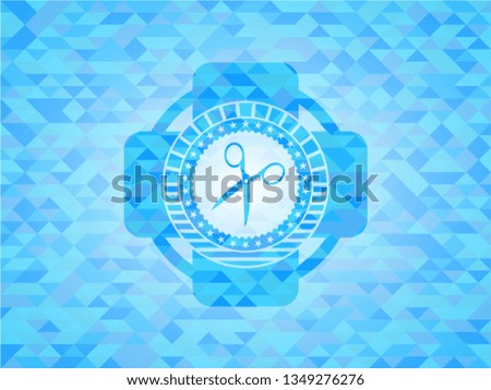 scissors icon inside light blue mosaic emblem