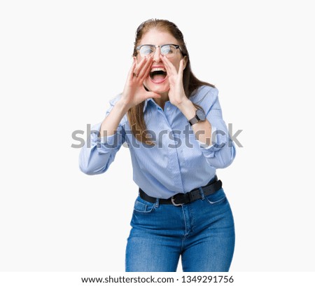 Beautiful middle age mature business woman wearing glasses over isolated background Shouting angry out loud with hands over mouth