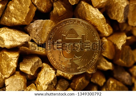 Golden Bitcoin Coin and mound of gold. Bitcoin cryptocurrency. Business concept.