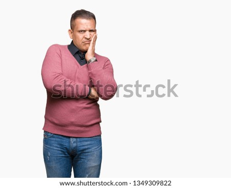 Middle age arab man over isolated background thinking looking tired and bored with depression problems with crossed arms.