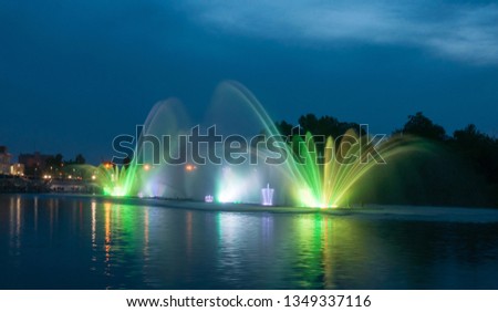 Beautiful evening view on multimedia floating fountain on the Southern Buh River in Vinnytsia, Ukraine.