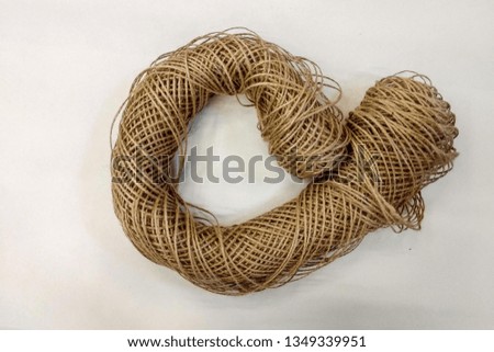 Skein of natural jute twine  on white.
