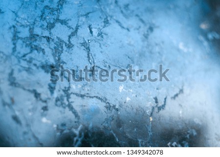 Black Polished Granite Wall. Reflection of a Blue Sky in a Polished Granite Surface