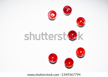 Numbers made of colored candles, tealight on blank, isolated background